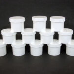 Set Of 12 White Plastic Jars/Caps - 2 oz.